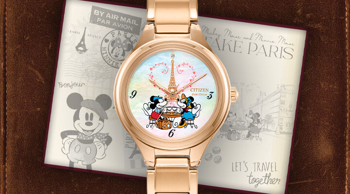 Disney Watches; Featuring Mickey Mouse & Minnie Mouse Take Paris watch model FE2103-52D on a leather background