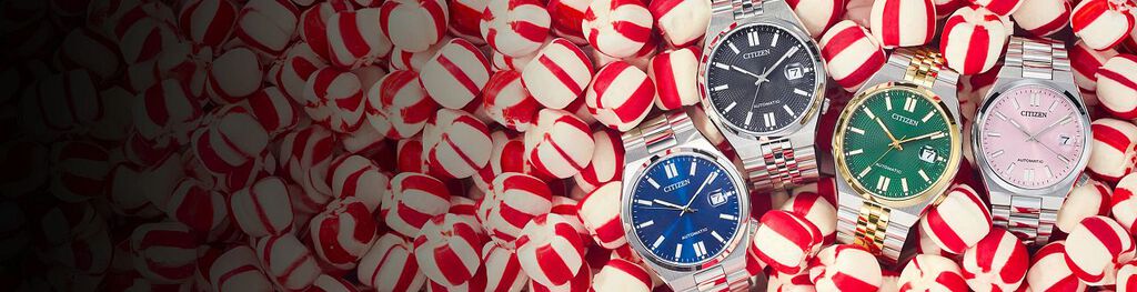 Image of four TSUYOSA watch models NJ0150-56L, NK0020-55E, NK0024-54X and NJ0200-50Z laying on a holiday peppermint candy background