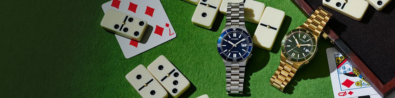Father's Day Gift Guide; Featuring an image of TSUYOSA Shore watch models NJ0230-59L and NJ0232-53X on a poker table.