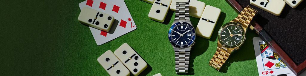 Father's Day Gift Guide; Featuring an image of TSUYOSA Shore watch models NJ0230-59L and NJ0232-53X on a poker table.