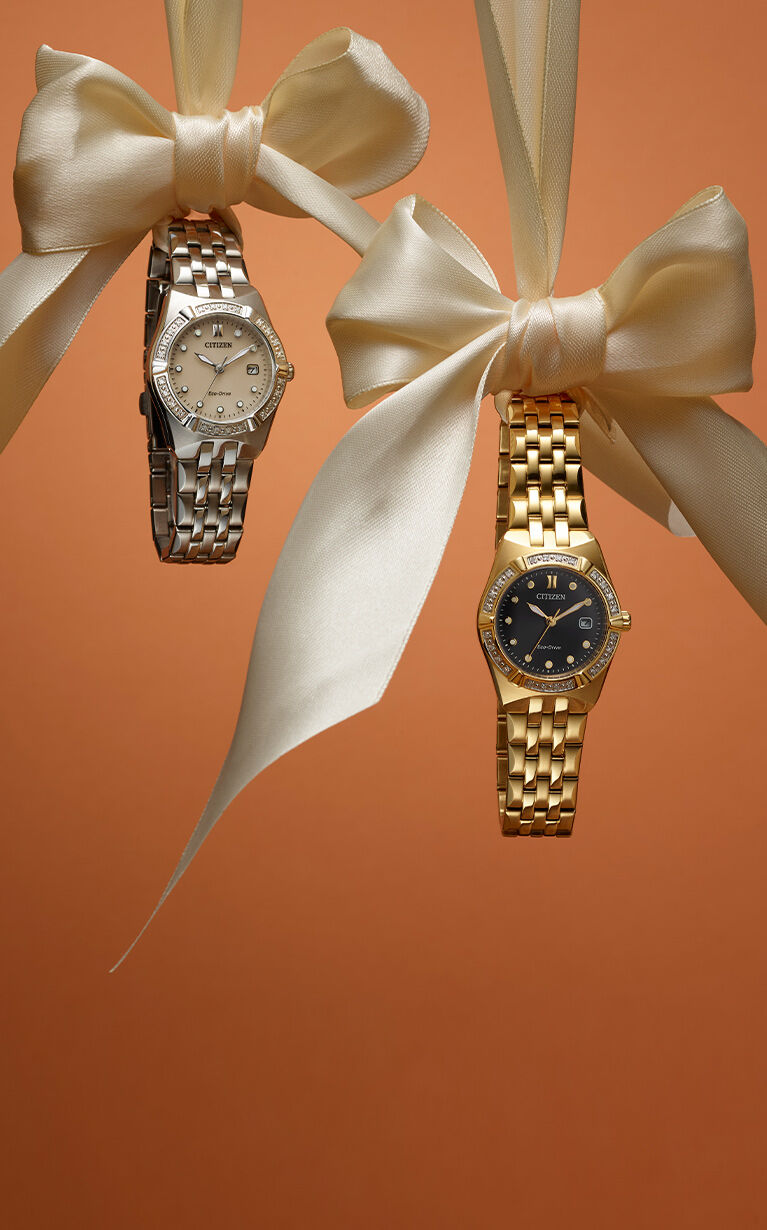 Mother's Day Gift Guide; Featuring an image of Corso Diamond watch models EW2710-51X and EW2712-55E hanging from bows