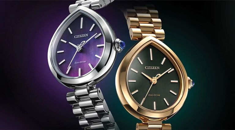 Women's New Arrival Watches; Image of two Citizen L Rainell watches EM1200-55X and EM1203-57X on a dark purple and green background