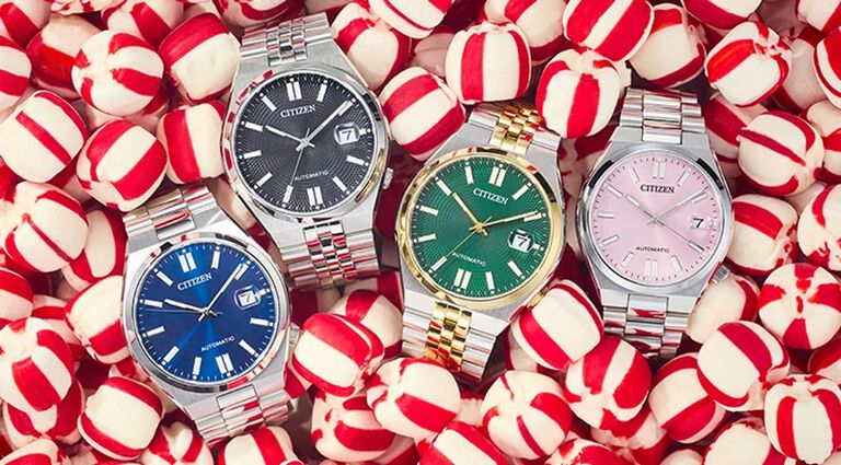Image of four TSUYOSA watch models NJ0150-56L, NK0020-55E, NK0024-54X and NJ0200-50Z laying on a holiday peppermint candy background