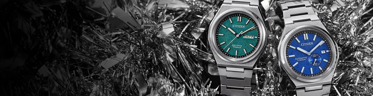 Zenshin Watches; Featuring an image of two Zenshin watch models AW0130-85X and NJ0180-80L on a silver holiday tinsel background