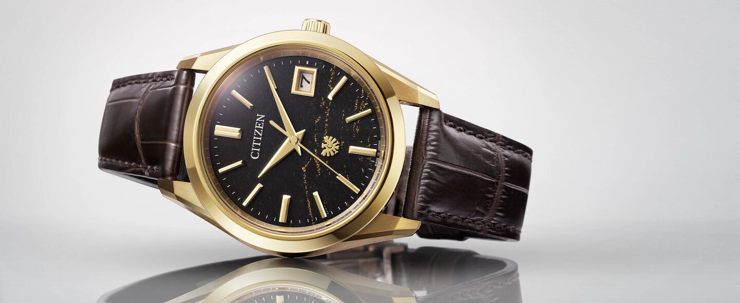 The CITIZEN Watches; Featuring an image of The CITIZEN watch model AQ4103-16W on a gray background