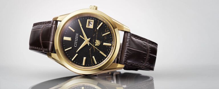 The CITIZEN Watches; Featuring an image of The CITIZEN watch model AQ4103-16W on a gray background