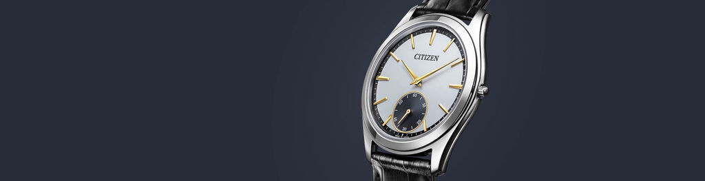 Eco-Drive One watches, featuring Eco-Drive One model AQ5010-01A image on a navy background.