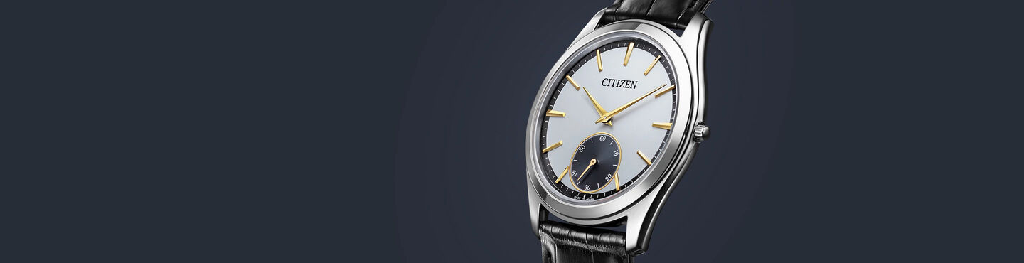 Eco-Drive One watches, featuring Eco-Drive One model AQ5010-01A image on a navy background.