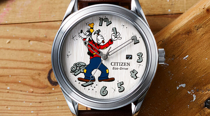 Disney Watches: Featuring image of Fix-It Goofy watch model AW1690-08W on a wood background