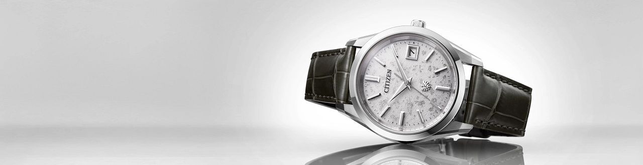 New Arrivals, featuring The CITIZEN watch model AQ4100-22A on a gray background