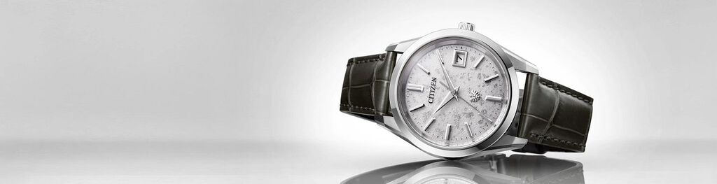 New Arrivals, featuring The CITIZEN watch model AQ4100-22A on a gray background