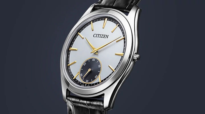 Eco-Drive One watches, featuring Eco-Drive One model AQ5010-01A image on a navy background.