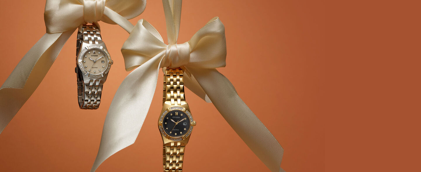 Mother's Day Gift Guide; Featuring an image of Corso Diamond watch models EW2710-51X and EW2712-55E hanging from bows