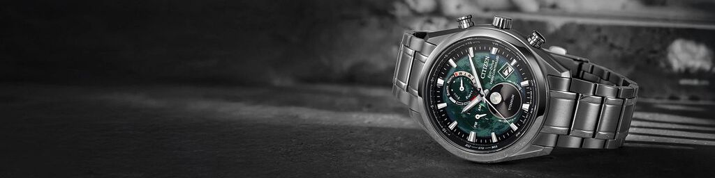 Green Dial Watches; Featuring an image of Tsuki-yomi A-T watch model BY1010-57X on a gray rock background