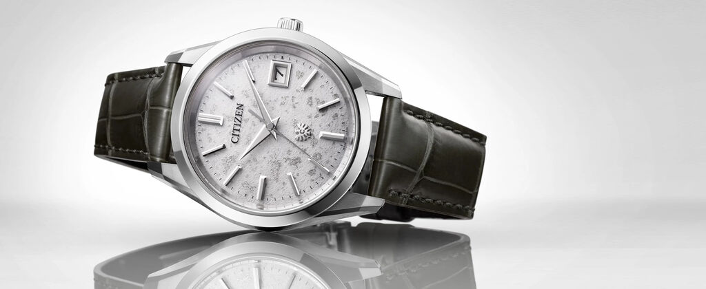 The CITIZEN Watches; Featuring an image of The CITIZEN watch model AQ4100-22A on a gray background