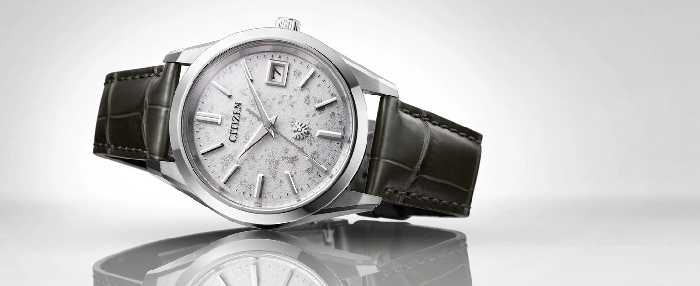 The CITIZEN Watches; Featuring an image of The CITIZEN watch model AQ4100-22A on a gray background
