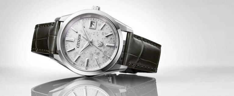 The CITIZEN Watches; Featuring an image of The CITIZEN watch model AQ4100-22A on a gray background