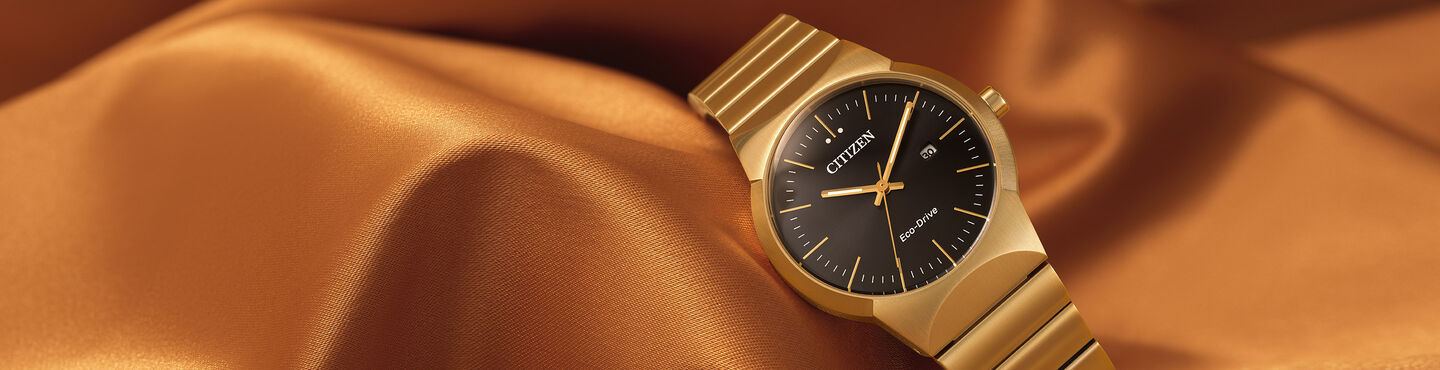 Axiom watches; Image of women's Axiom watch model EW2672-58E sitting on a gold fabric