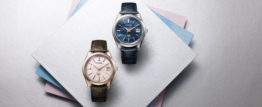 The CITIZEN Watches; Featuring an image of two The CITIZEN watch models AQ4100-22L and AQ4106-00A sitting on a background of complimentary color swatches