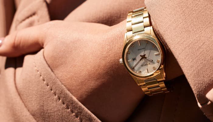 Woman wearing the Sports Luxury watch model EW2702-59D