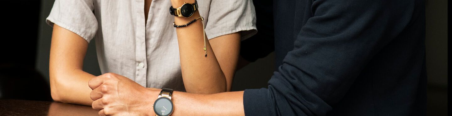 Gifts Under $550; Couple wearing the Axiom watch models AU1062-05E and GA1052-04E